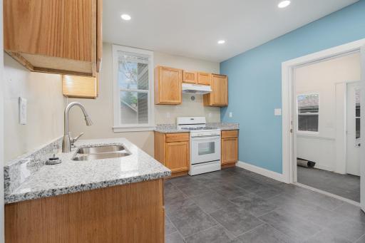 Granite counters, new appliances and walk out to back porch.