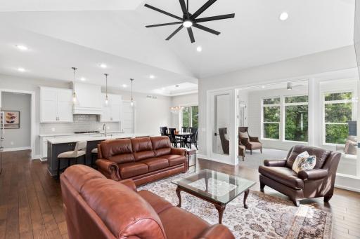 Soaring ceilings and gleaming hardwood floors throughout.