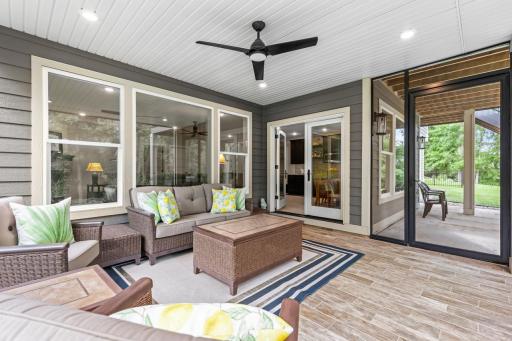 Professionally finished screened-in porch with tiled flooringâenjoy the outdoors in comfort and style.