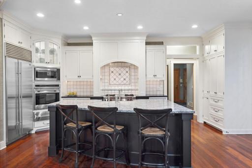 Gorgeous open kitchen with Wolf range & ovens, and Sub-Zero refridgerator