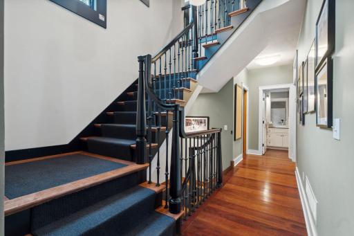 Grand staircase is one of two leading upstairs