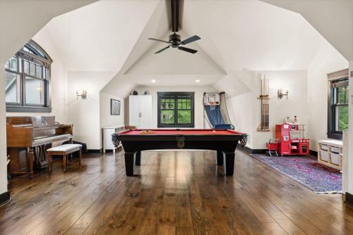 Upstairs flex room / play room with vaulted ceilings