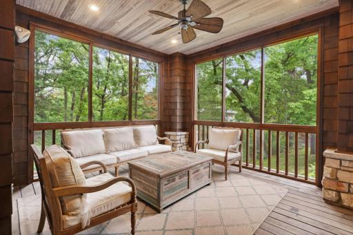 Main floor screened in porch provides a private respite at the end of the day