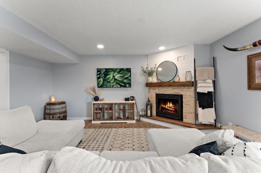 Newly finished fireplace in lower level, recessed lights, new flooring