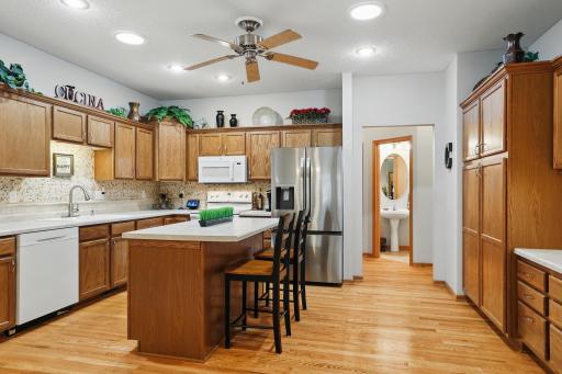 kitchen with an island and you can see the half bath