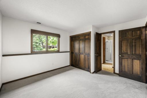 Basement bedroom has direct bathroom access.