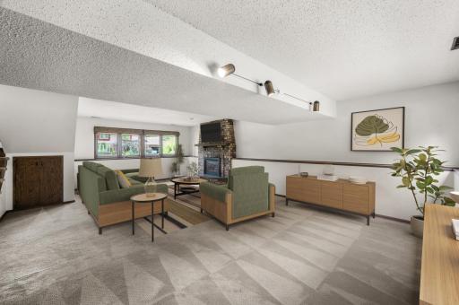 Lookout windows on both sides of the basement bring in great natural light. (virtually staged)
