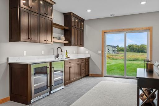 Wet bar w/2 wine fridges and lots of cabinet space!