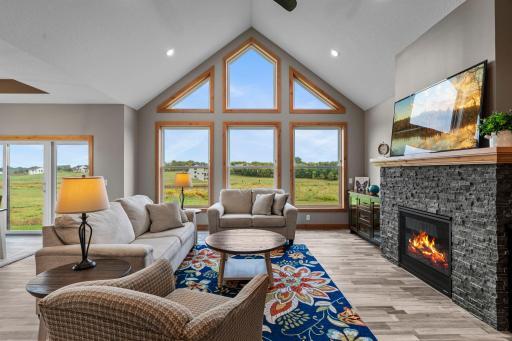 Great room to cozy up next to a fire AND next to the kitchen! Perfect combo!