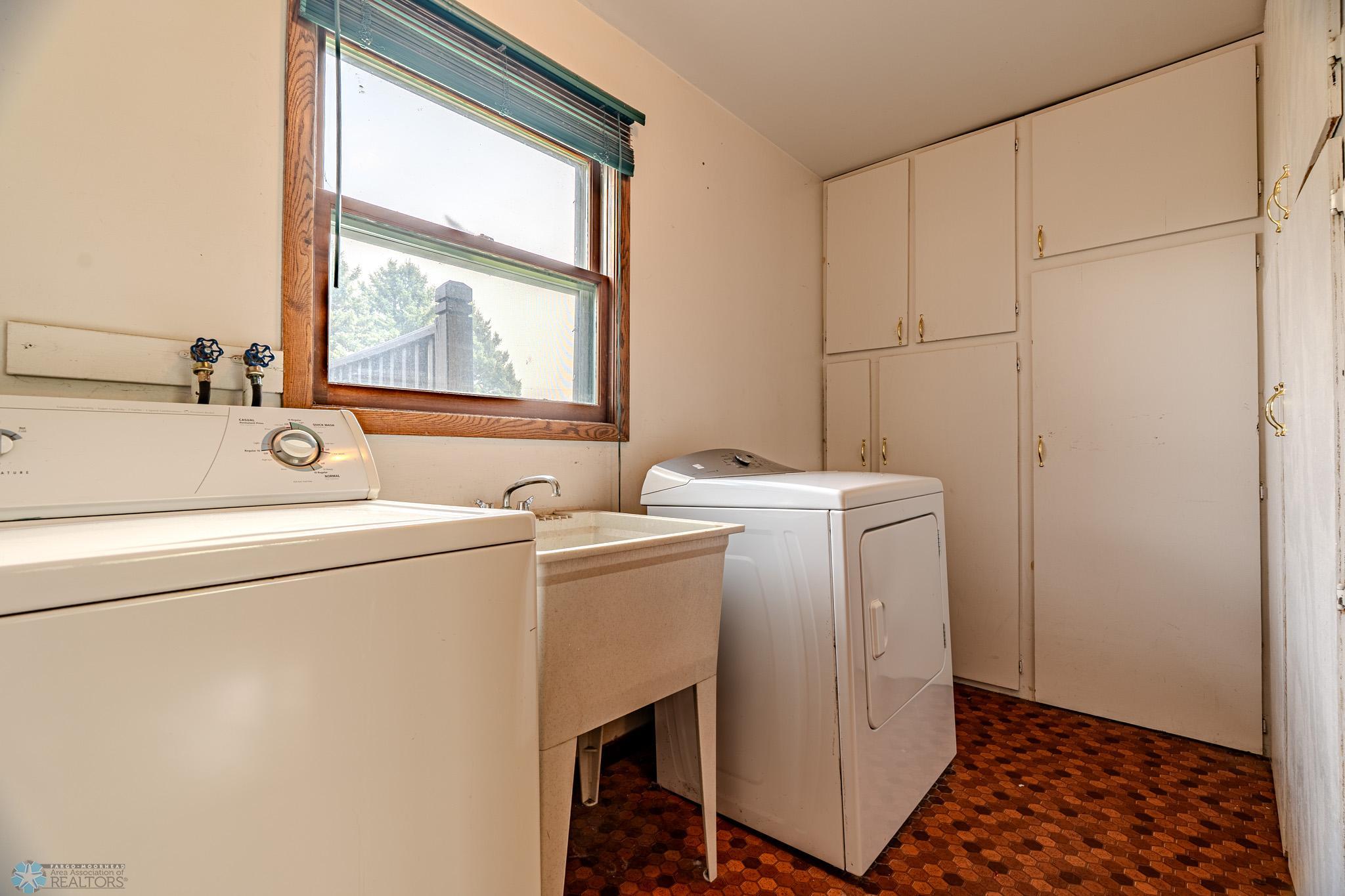 Main Floor Laundry Room with Storage