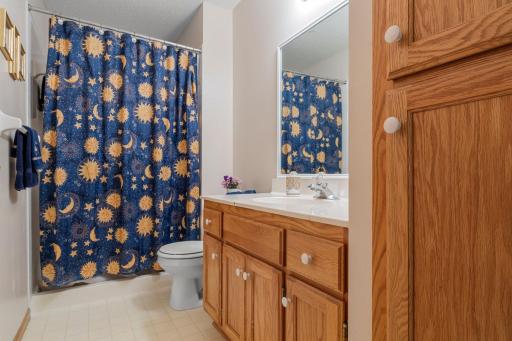Both lower level bedrooms are conveniently located just steps from the lower-level shared ¾ bathroom, which includes a walk-in shower, single vanity, and a linen cabinet.