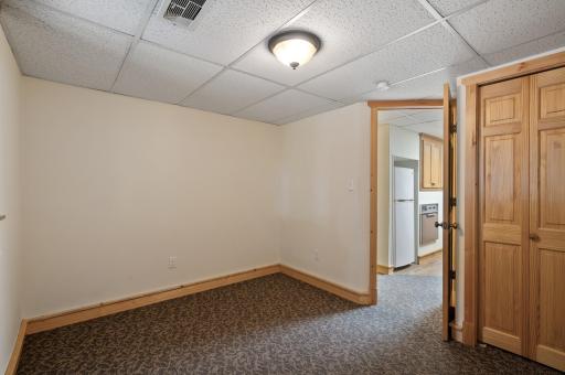 This flexible lower level space is ideal as a guest bedroom, home office, or for accommodating others.