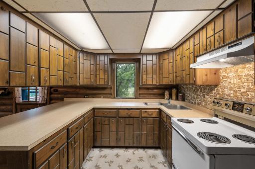 A bright kitchen window fills the space with natural light and offers serene views of nature from the comfort of your home.