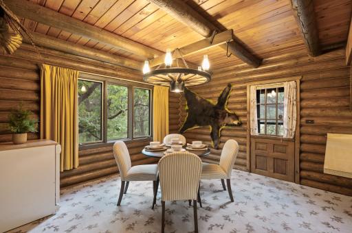 The cozy dining area is ideal for everyday meals and offers easy access to your deck extending your living and entertaining space outdoors.