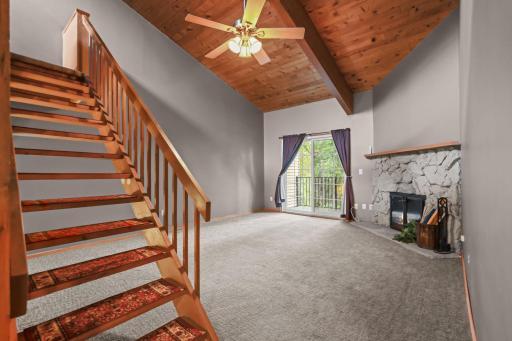 Soaring vaulted ceilings and walks out to deck