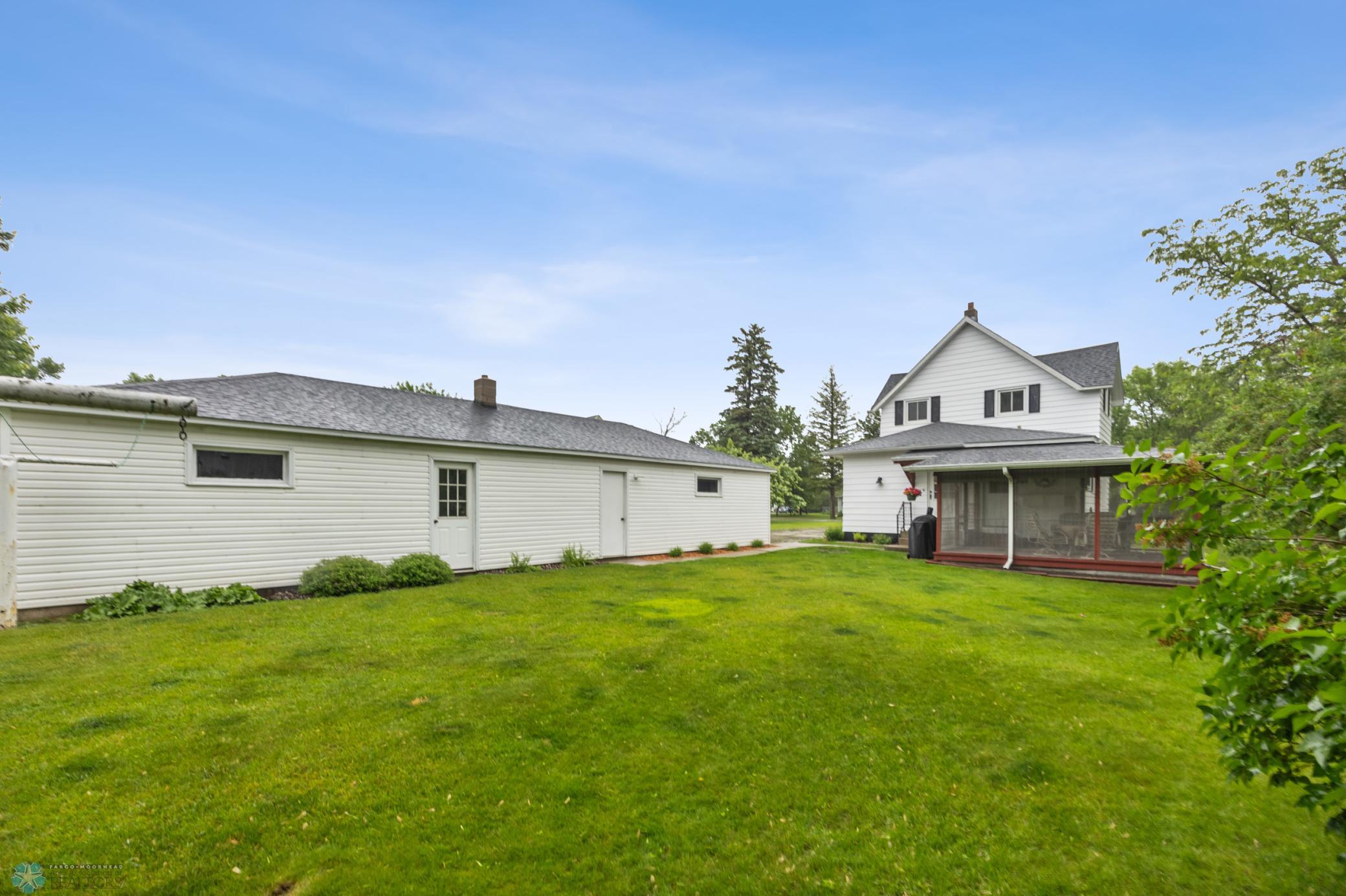 Backyard view of house & garage