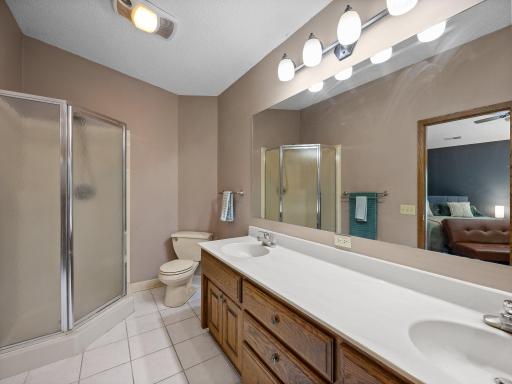 The primary bathroom features double sinks and a separate tub and shower.