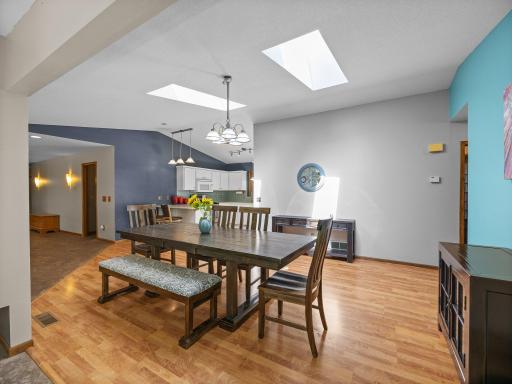The main level features an open floor plan and skylights over the dining area.
