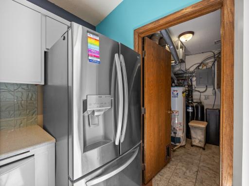 The utility room is conveniently located off the kitchen.