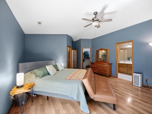 The primary bedroom features a walk-in closet, ensuite bathroom, and a gas fireplace.