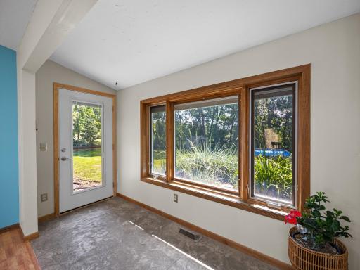 Just off the dining area there is access to the backyard.