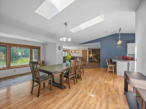 The main level features an open floor plan and skylights over the dining area.
