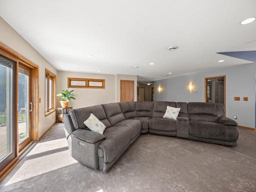 The living room offers access to the expansive maintenance free deck.