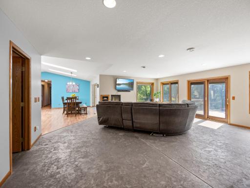 The living room features a stamped concrete floor that includes in-floor heat.