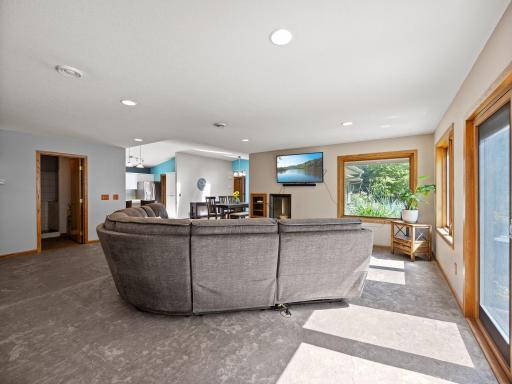 The living room offers access to the expansive maintenance free deck.