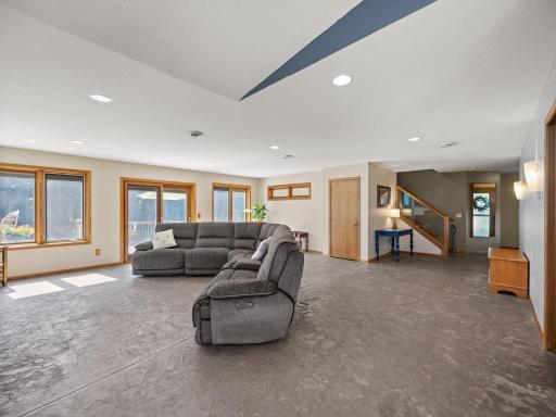 The living room features a stamped concrete floor that includes in-floor heat.