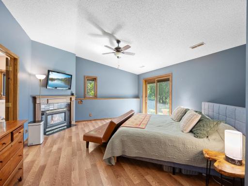 The primary bedroom features a walk-in closet, ensuite bathroom, and a gas fireplace.