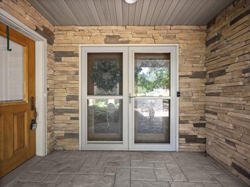 The covered entry area is finished with stone accents.