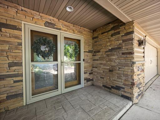 The covered entry area is finished with stone accents.