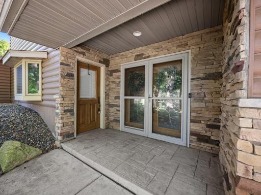 The covered entry area is finished with stone accents.