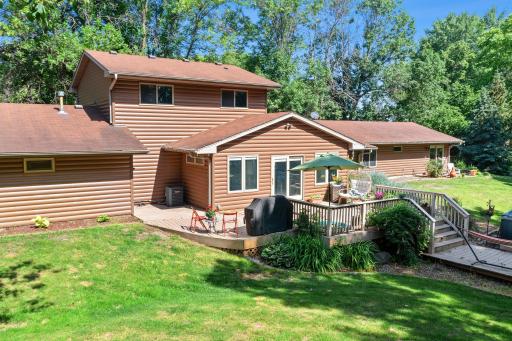 The backyard features a large maintenance free deck and gorgeous landscaping.