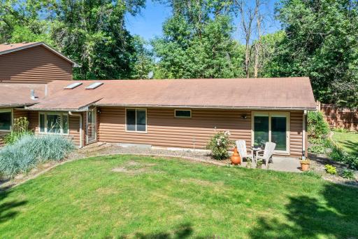 The backyard is a perfect combination of open space, beautiful landscaping and privacy.