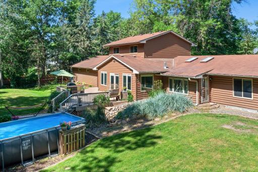 The backyard is a perfect combination of open space, beautiful landscaping and privacy.