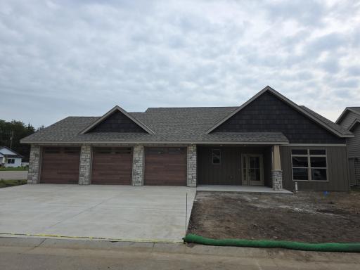 Beautiful Home with Steet Siding, Natural Stone, Concrete Driveway, and Full Landscape Package Providing Great Curb Appeal!!!