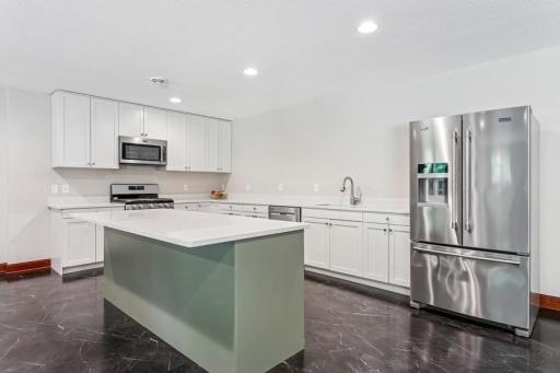New second kitchen on lower level w/quartz counters
