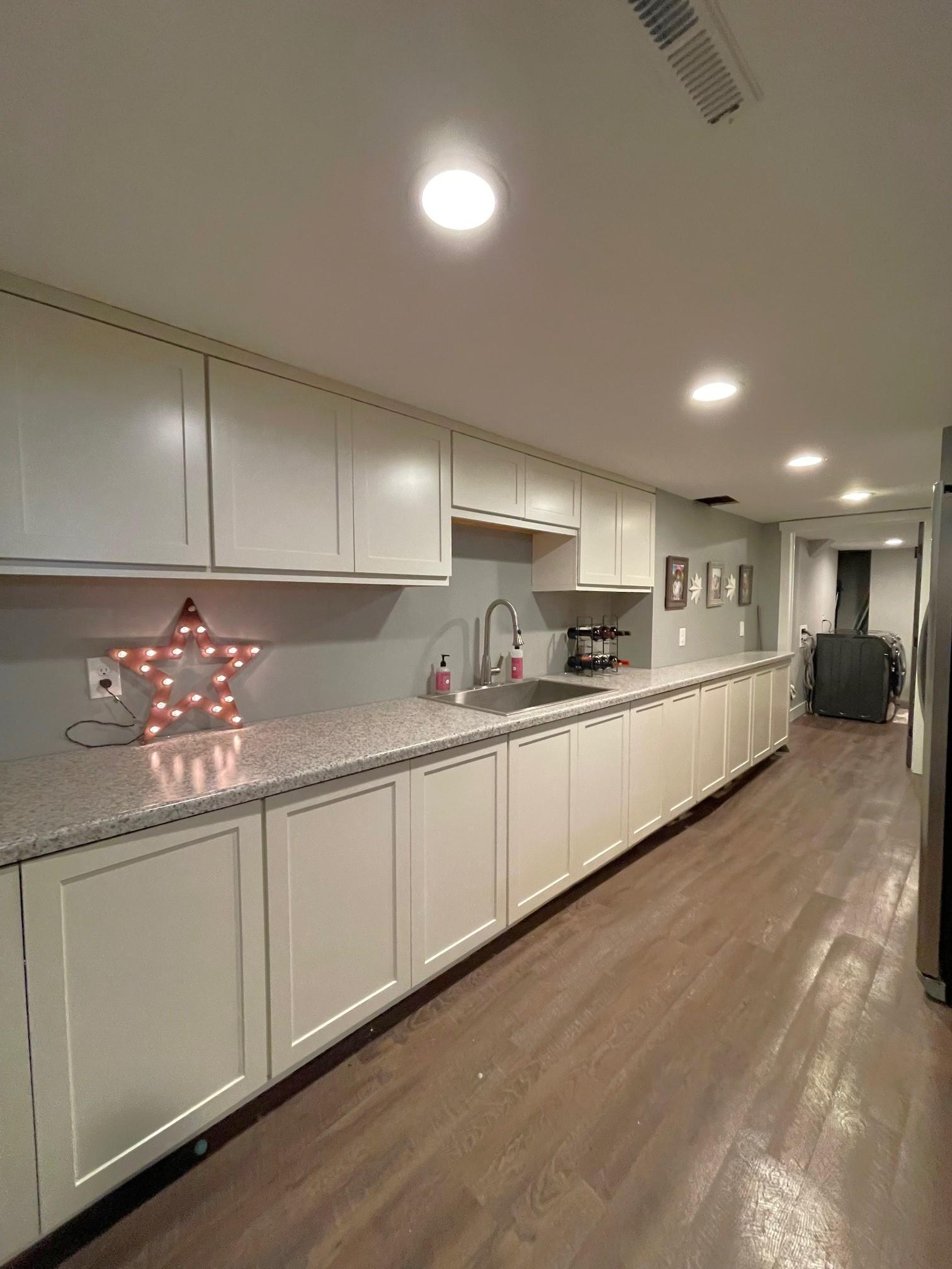 Wet bar area would also make a great craft room!