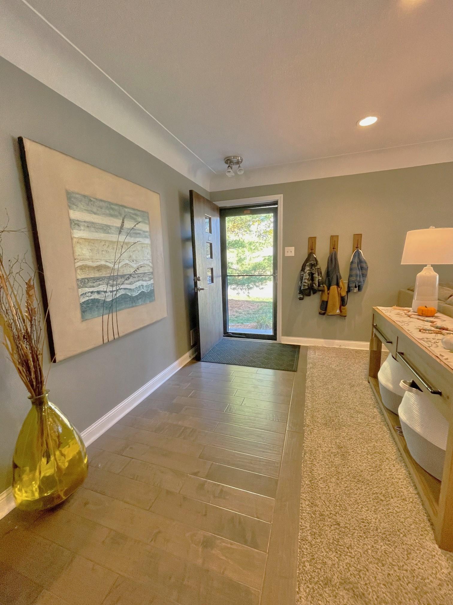 Huge foyer with adjacent living room.