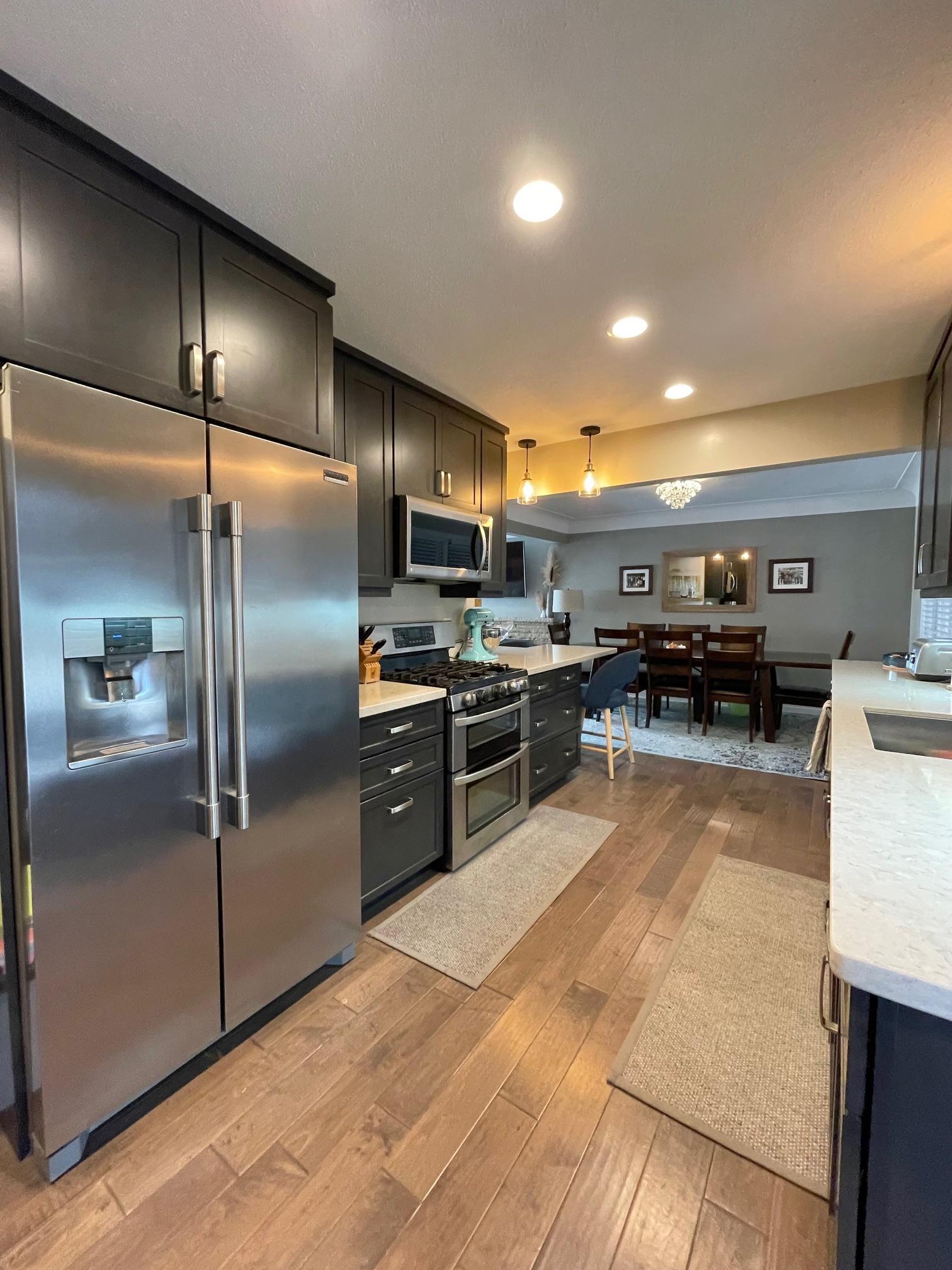Kitchen is fully remodeled with stainless steel appliances.