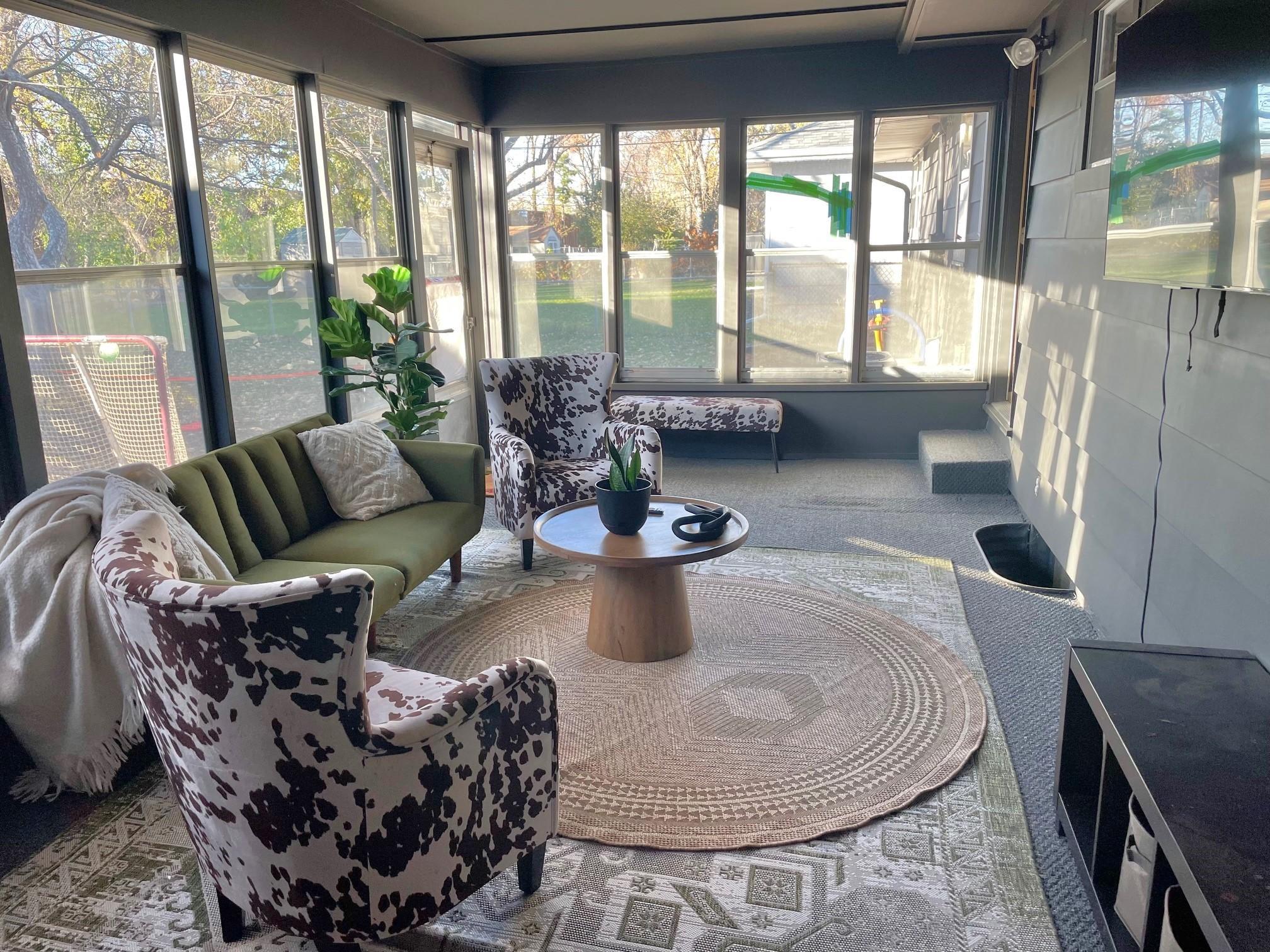 Screened porch off the kitchen area with access to garage.