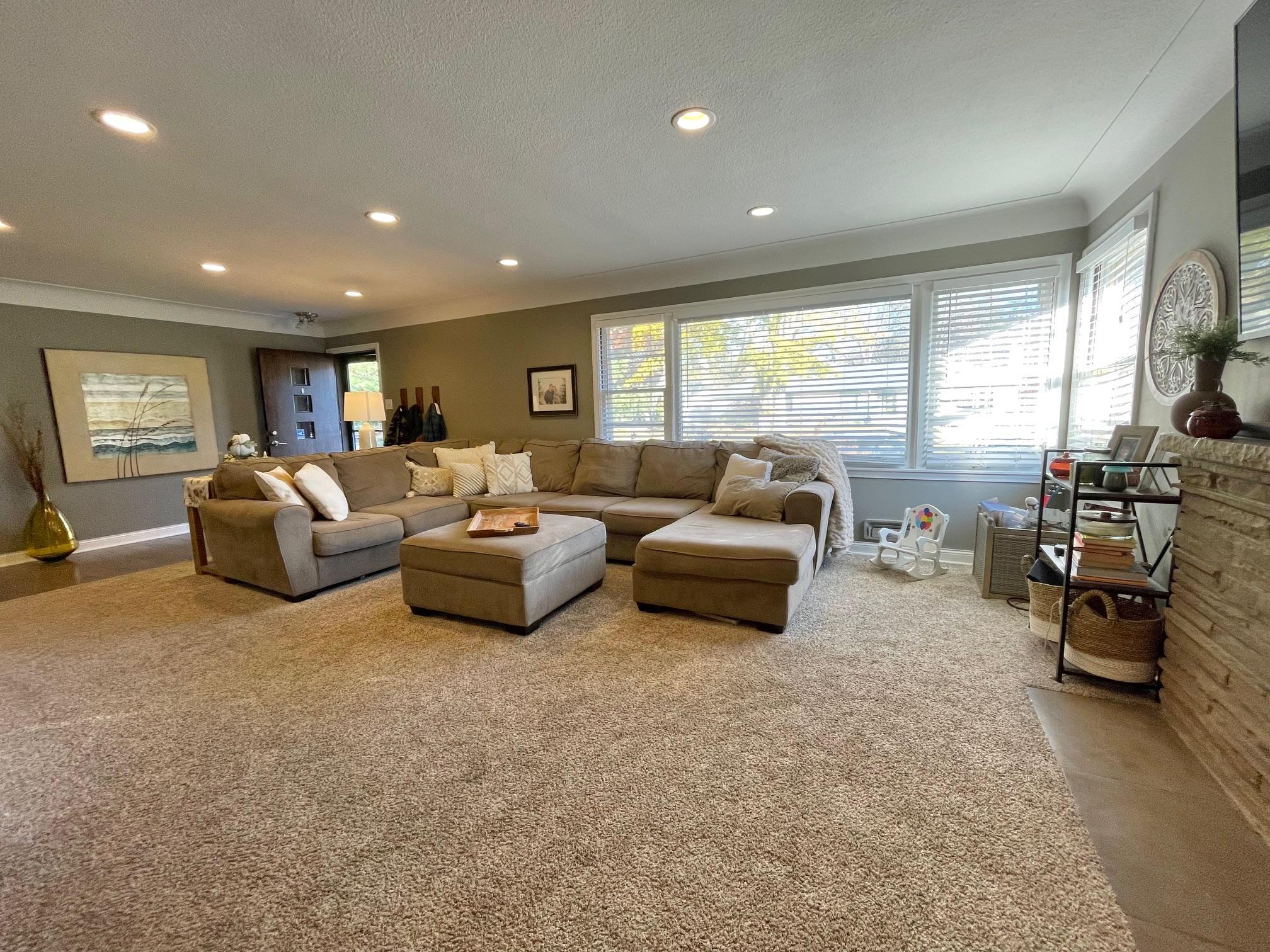 Lots of natural lighting in this spacious living room!