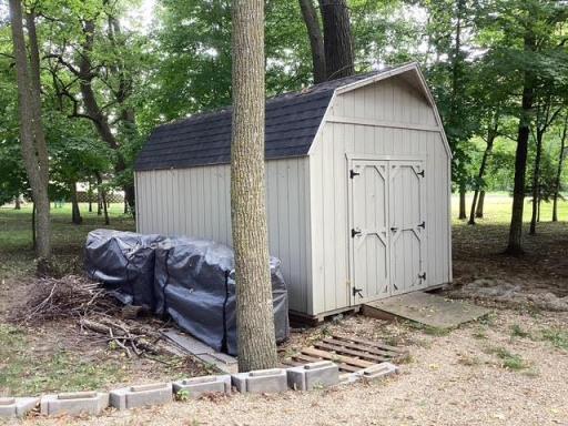 Shed with electric service/firewood