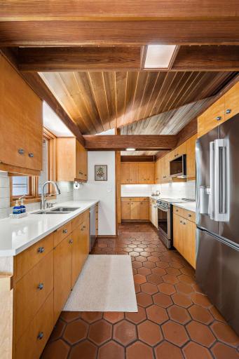 High ceilings elevate the kitchen, creating an open, airy feel that enhances the sense of space and light.