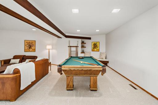 New Carpet throughout lower-level and uniquely designed built-in bench and shelves for rec area