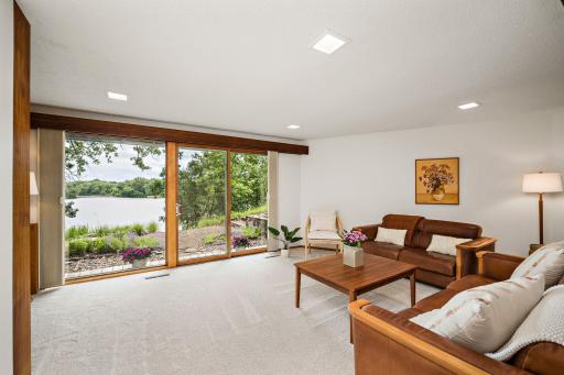 Large slider and floor to ceiling picture window allow the natural light to pour in and provides amazing views of the lake!