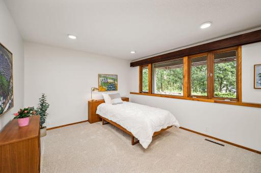 Spacious Bedroom 3 also has expansive views of the lake!