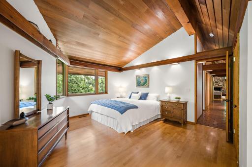 Generously-sized primary bedroom with lake views